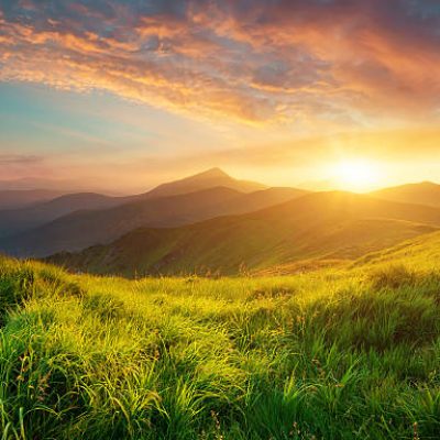 Mountain valley during sunrise. Natural summer landscape